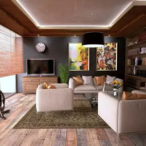Moderner Wohnraum mit Couch und Loungesessel neben einer Fensterfront